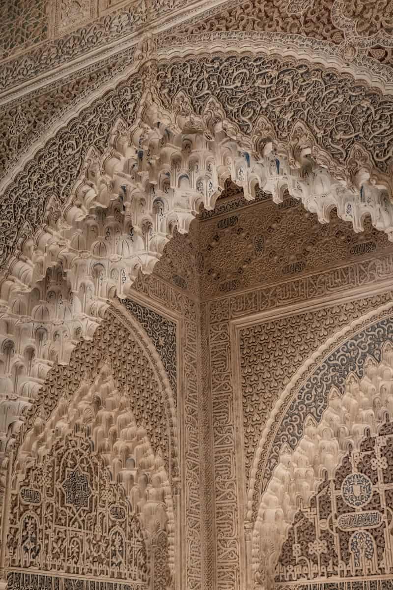 an intricately decorated wall in a building