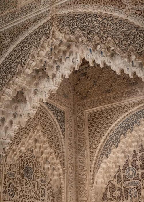 an intricately decorated wall in a building